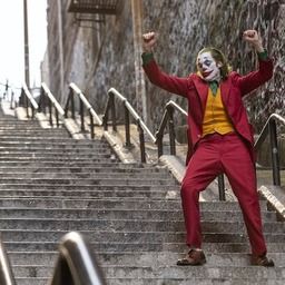 Scene of Joker dancing while walking down the stairs